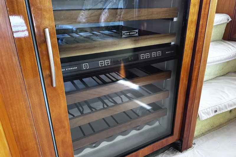 Times Like These Yacht Photos Pics Sub-Zero wine storage in 2004 McKinna 57 PHMY yacht interior.