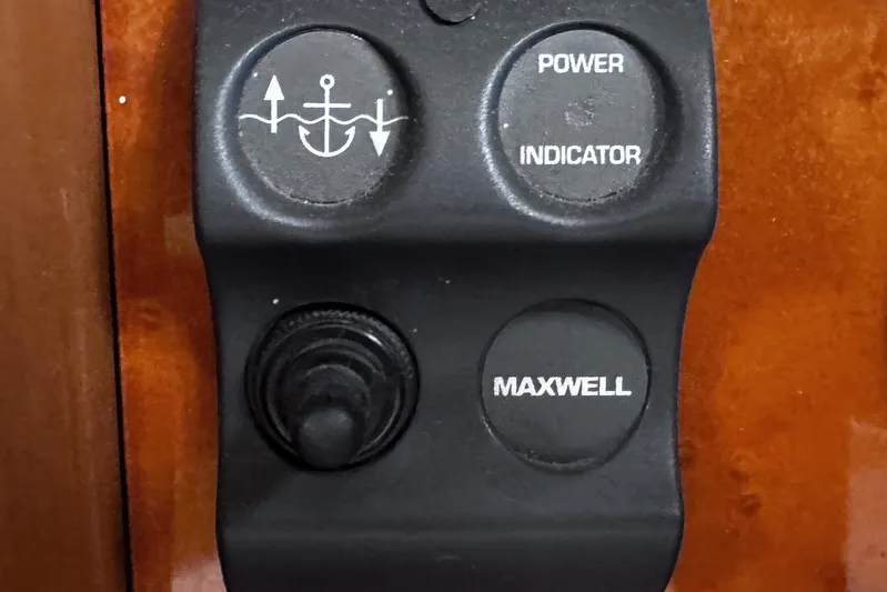 Times Like These Yacht Photos Pics Control panel of a 2004 McKinna 57 PHMY yacht with anchor and power buttons.