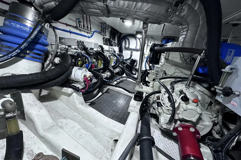 Times Like These Yacht Photos Pics Engine room of a 2004 McKinna 57 PHMY Widebody yacht, showcasing complex machinery and stabilization systems.