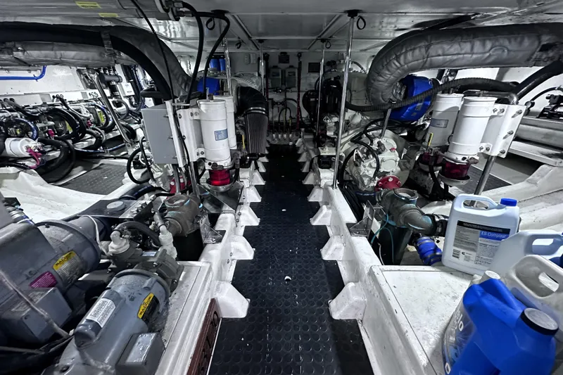 Times Like These Yacht Photos Pics Engine room of 2004 McKinna 57 PHMY Widebody yacht, showcasing complex machinery and equipment.