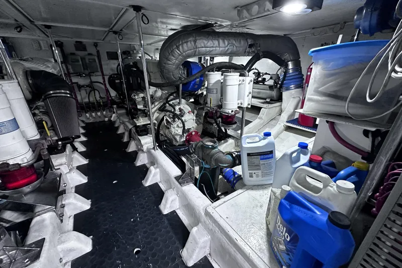 Times Like These Yacht Photos Pics Engine room of a 2004 McKinna 57 PHMY Widebody yacht, featuring various mechanical components.