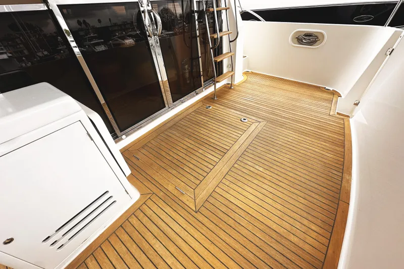 Times Like These Yacht Photos Pics 2004 McKinna 57 PHMY yacht deck with teak flooring and stainless steel accents.