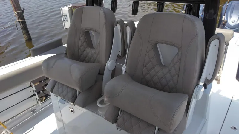 Yacht Photos Pics 2022 Sportsman Open 302 Center Console boat seats with diamond stitching.