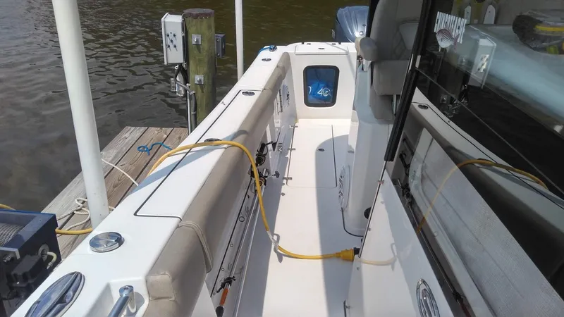  Yacht Photos Pics 2022 Sportsman Open 302 Center Console boat docked, interior view.