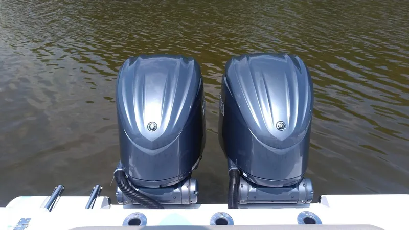  Yacht Photos Pics Twin outboard motors on a 2022 Sportsman Open 302 Center Console boat.