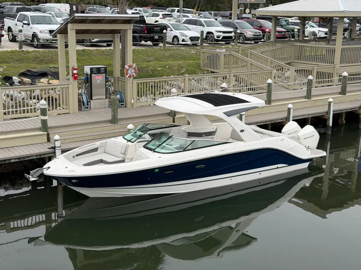  Yacht Photos Pics 2024 Sea Ray SLX 310 Outboard at dock, sleek design.
