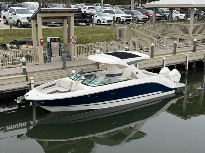  Yacht Photos Pics 2024 Sea Ray SLX 310 Outboard at dock, sleek design.