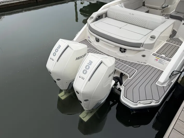  Yacht Photos Pics 2024 Sea Ray SLX 310 Outboard with Mercury engines at dock.