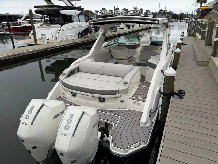  Yacht Photos Pics 2024 Sea Ray SLX 310 Outboard at dock with twin engines.