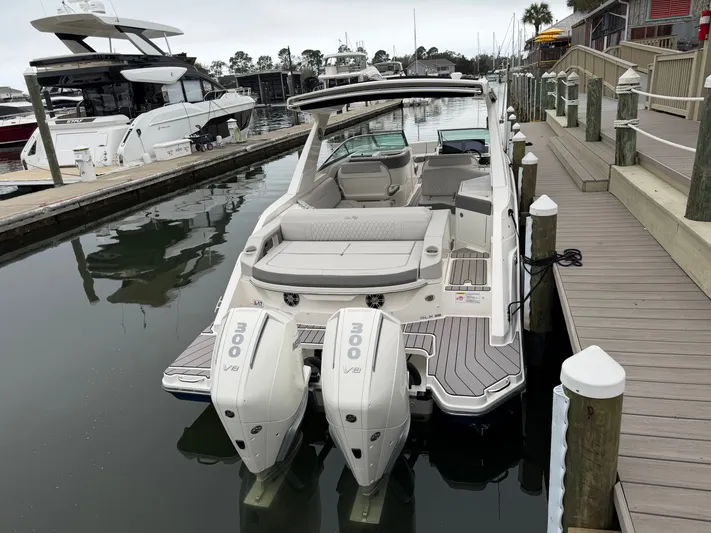  Yacht Photos Pics 2024 Sea Ray SLX 310 Outboard at dock, luxurious design.
