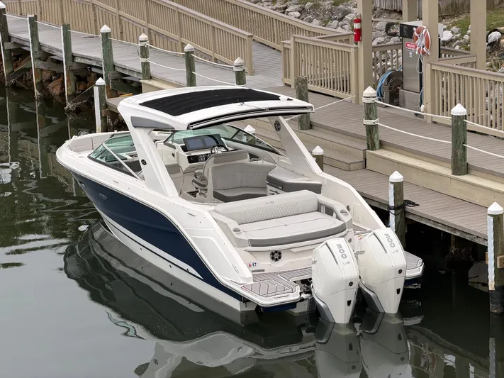  Yacht Photos Pics 2024 Sea Ray SLX 310 Outboard at dock, luxurious design.
