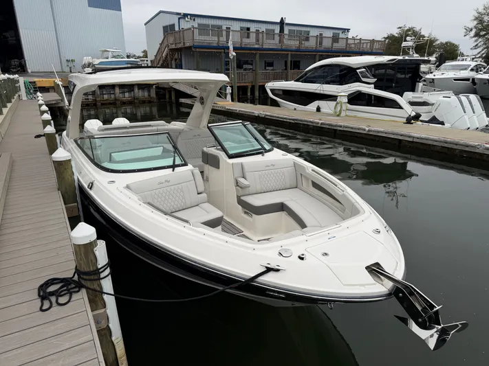  Yacht Photos Pics 2024 Sea Ray SLX 310 Outboard at dock, luxurious design.