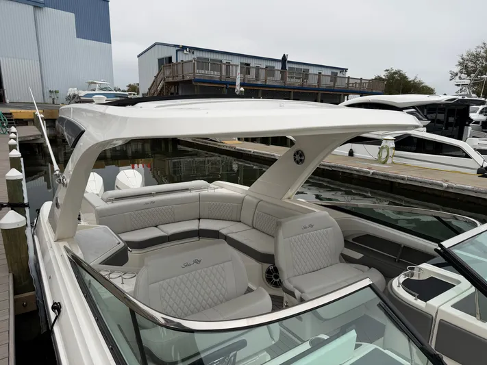  Yacht Photos Pics 2024 Sea Ray SLX 310 Outboard at a marina, luxurious design.