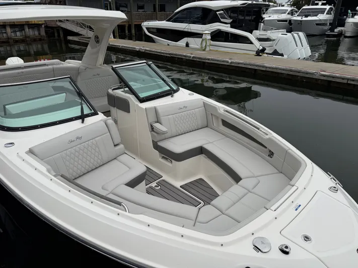  Yacht Photos Pics 2024 Sea Ray SLX 310 Outboard, luxury boat docked.