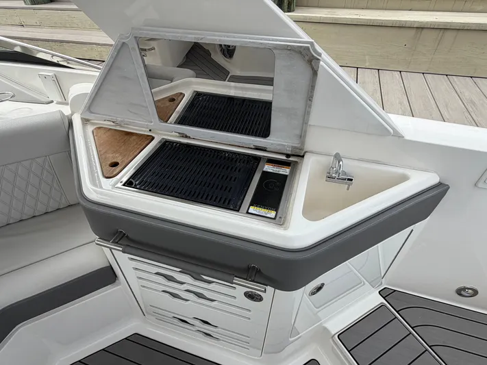  Yacht Photos Pics 2024 Sea Ray SLX 310 Outboard with integrated grill and sink.