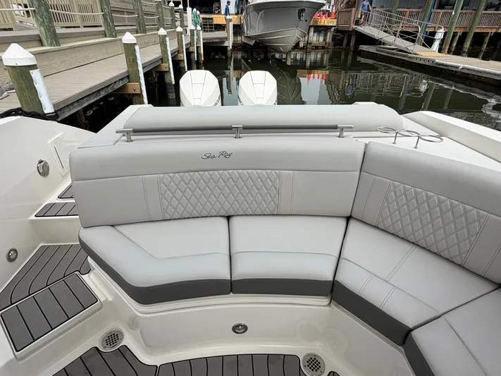  Yacht Photos Pics 2024 Sea Ray SLX 310 Outboard, luxurious seating in harbor.