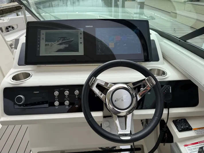  Yacht Photos Pics 2024 Sea Ray SLX 310 Outboard helm with modern controls.