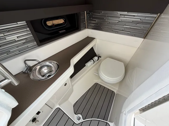  Yacht Photos Pics Interior of 2024 Sea Ray SLX 310 Outboard with sink and toilet.