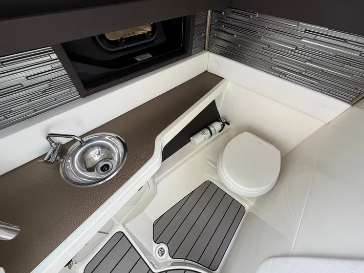  Yacht Photos Pics Interior of 2024 Sea Ray SLX 310 Outboard with sink and toilet.