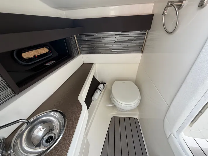  Yacht Photos Pics Interior of 2024 Sea Ray SLX 310 Outboard with toilet and sink.