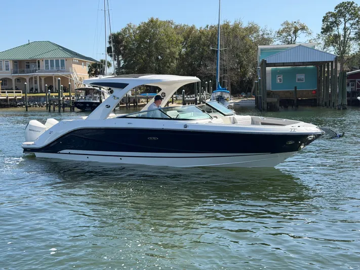  Yacht Photos Pics 2024 Sea Ray SLX 310 Outboard on calm waters.