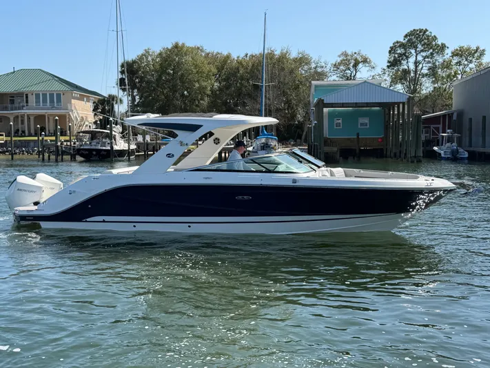  Yacht Photos Pics 2024 Sea Ray SLX 310 Outboard on calm water.