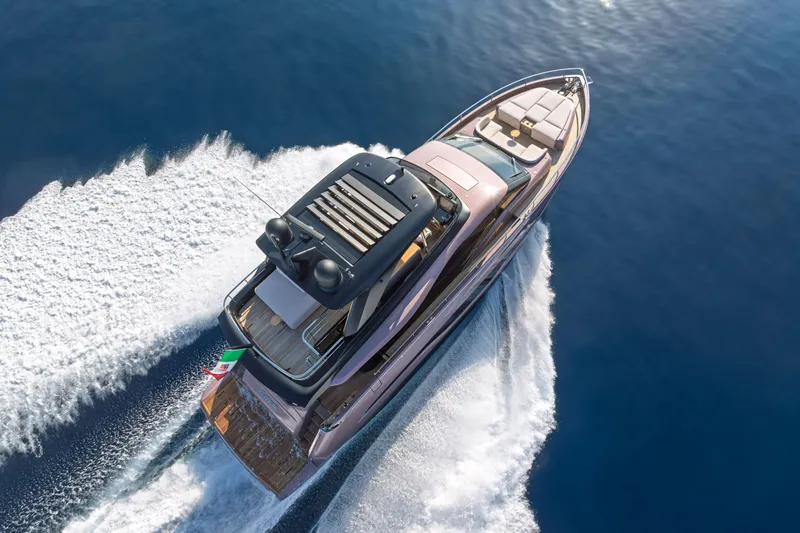  Yacht Photos Pics 2026 Cranchi Sessantadue 62 yacht cruising on open water, aerial view.