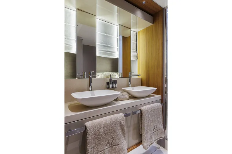  Yacht Photos Pics Luxury bathroom in 2026 Cranchi Sessantadue 62 yacht with dual sinks and elegant design.