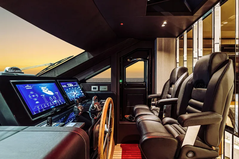  Yacht Photos Pics Luxurious 2026 Cranchi Sessantadue 62 yacht cockpit with advanced navigation displays at sunset.