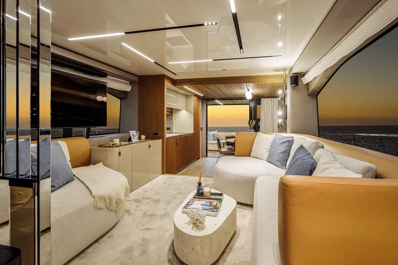  Yacht Photos Pics Luxurious interior of 2026 Cranchi Sessantadue 62 yacht at sunset, featuring elegant seating and decor.