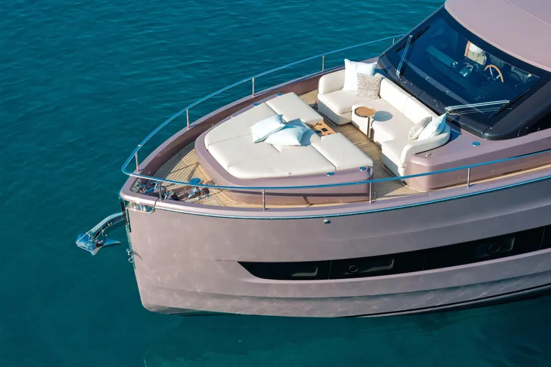  Yacht Photos Pics Luxurious 2026 Cranchi Sessantadue 62 yacht with elegant deck seating on tranquil water.