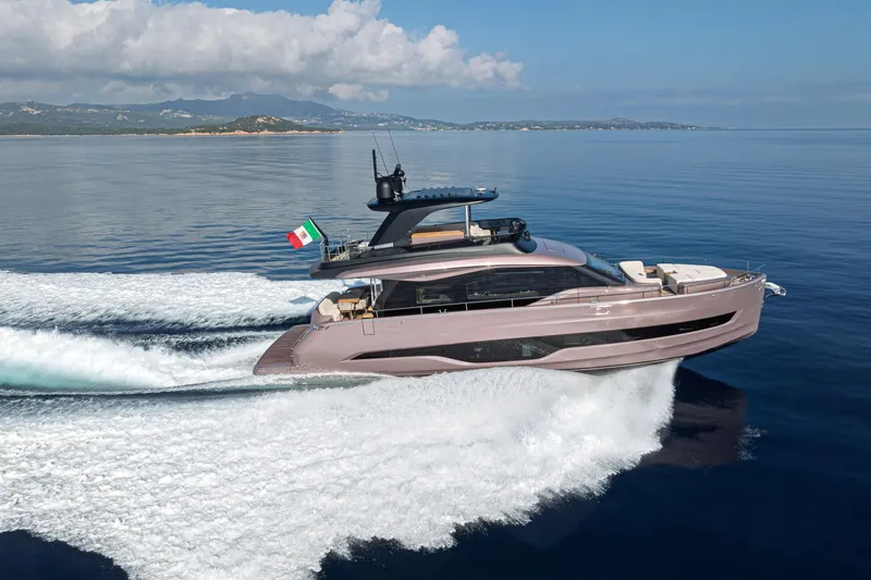  Yacht Photos Pics 2026 Cranchi Sessantadue 62 yacht cruising on calm blue waters.