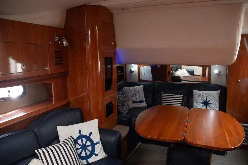  Yacht Photos Pics Interior of 2005 Four Winns 378 Vista yacht with wooden furnishings and nautical-themed decor.