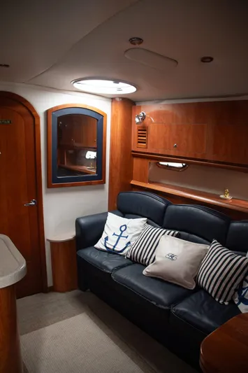  Yacht Photos Pics Interior of 2005 Four Winns 378 Vista yacht with leather seating and nautical-themed pillows.