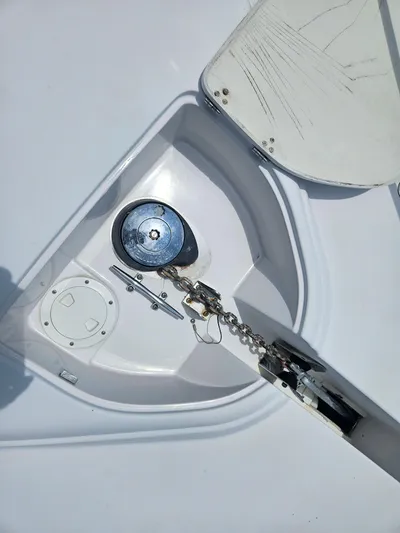  Yacht Photos Pics Anchor compartment of 2005 Four Winns 378 Vista boat, featuring chain and winch.