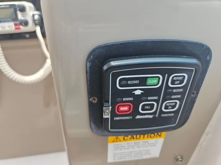  Yacht Photos Pics Control panel on a 2005 Four Winns 378 Vista boat, featuring emergency and communication buttons.