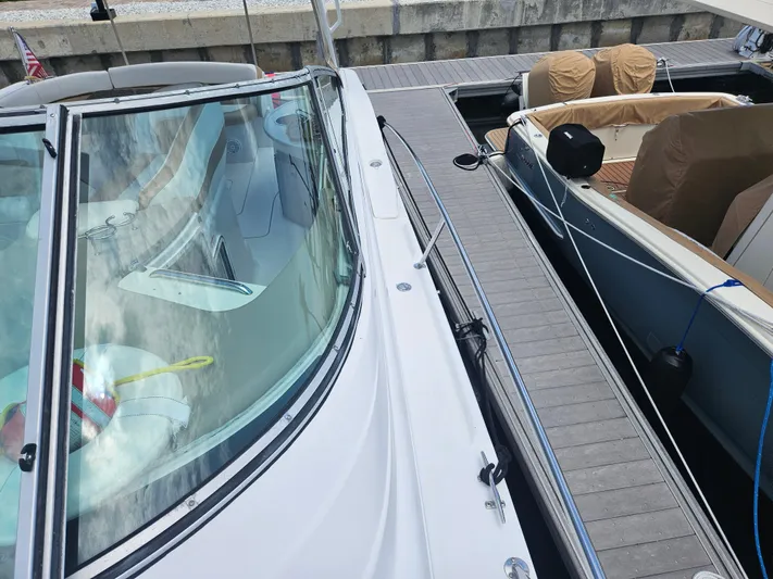  Yacht Photos Pics 2005 Four Winns 378 Vista docked alongside another boat.