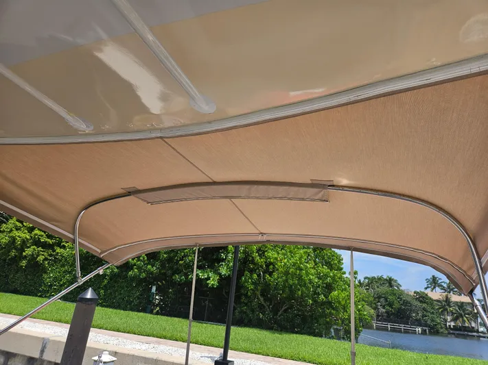  Yacht Photos Pics 2005 Four Winns 378 Vista boat canopy with scenic waterfront view.