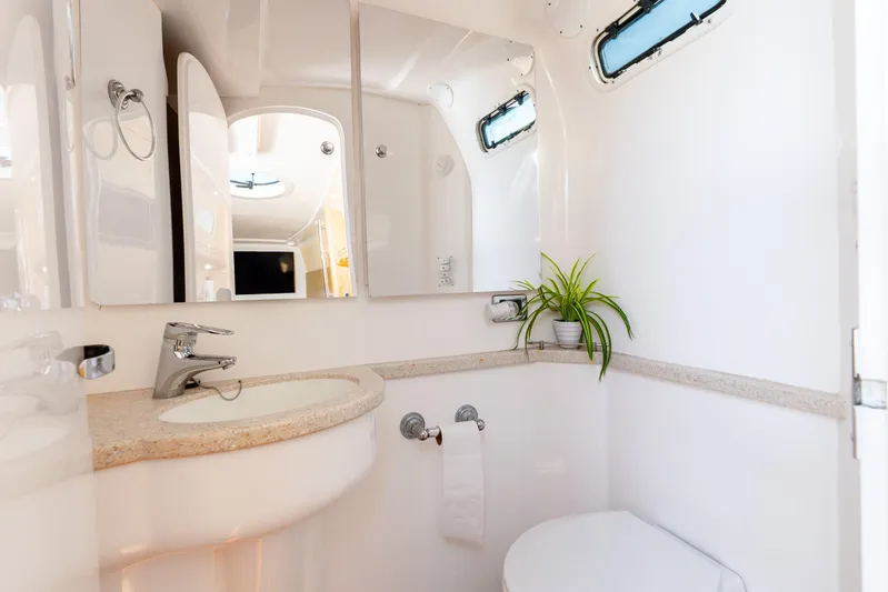  Yacht Photos Pics Luxurious bathroom interior of 2015 Intrepid 475 Panacea yacht with modern fixtures.