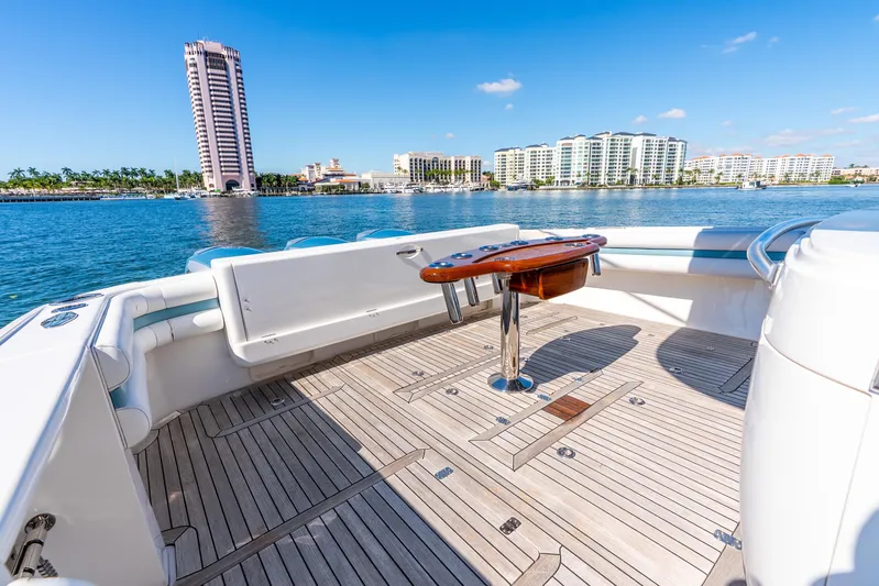  Yacht Photos Pics 2015 Intrepid 475 Panacea yacht deck with scenic waterfront view.