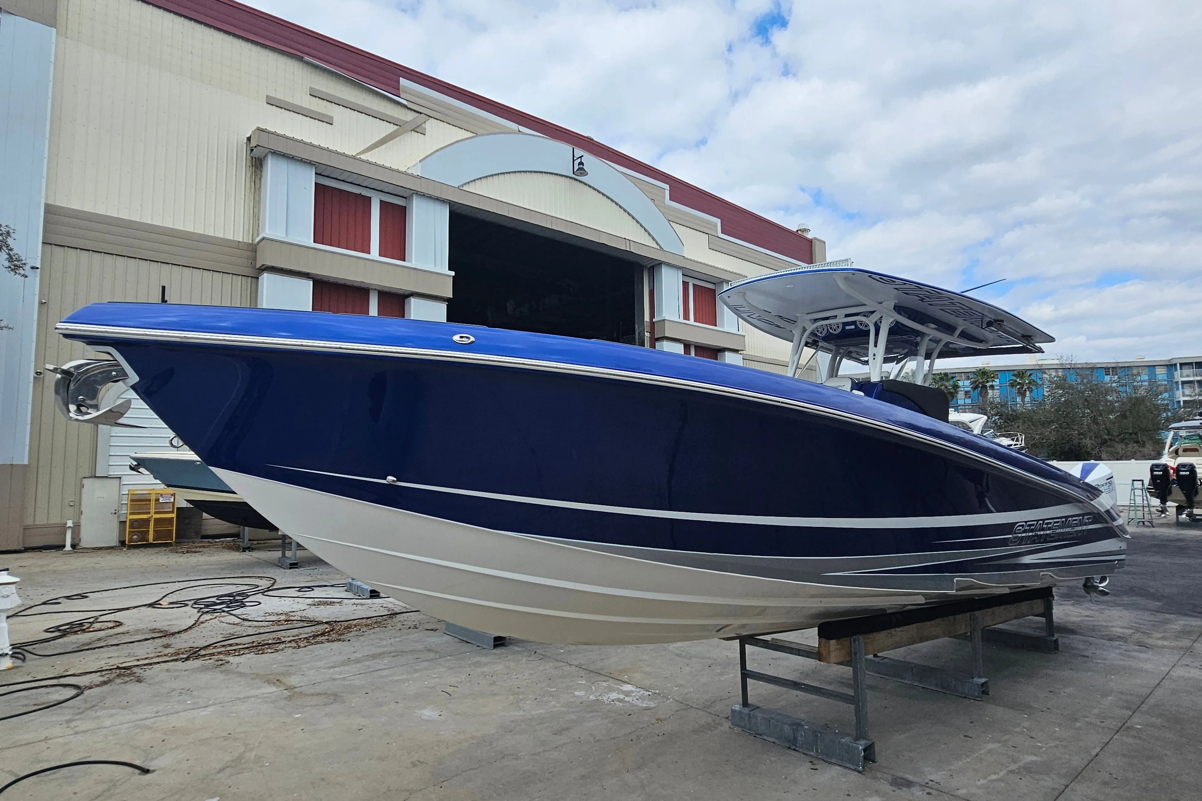 2022 Statement 380 Open boat in front of warehouse.