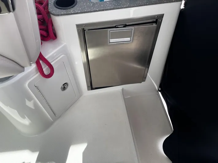  Yacht Photos Pics 2017 Boston Whaler 315 Conquest interior with stainless steel compartment and red rope.