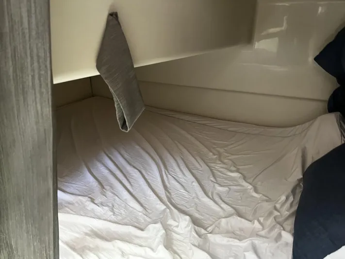  Yacht Photos Pics 2017 Boston Whaler 315 Conquest cabin interior with bed and pillow.