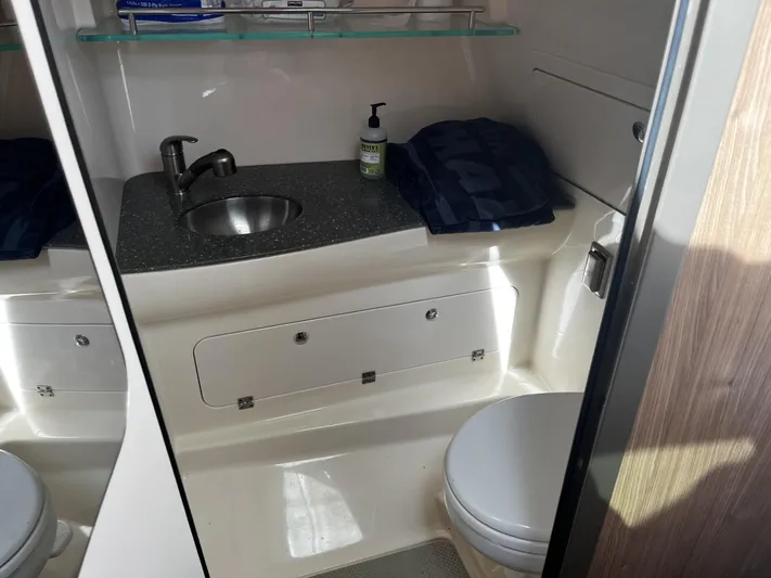  Yacht Photos Pics 2017 Boston Whaler 315 Conquest bathroom with sink, toilet, and storage.