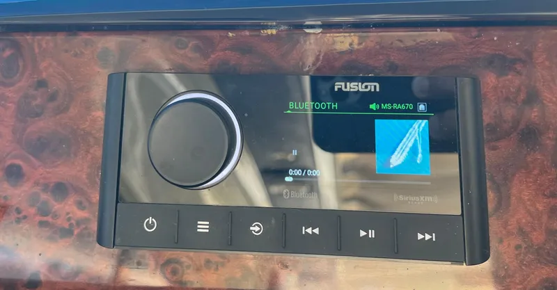 1691 Yacht Photos Pics Fusion Bluetooth stereo system on Princess V65 yacht dashboard, 2000 model.