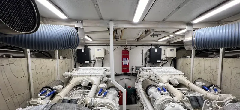 1691 Yacht Photos Pics Engine room of a 2000 Princess V65 yacht, featuring dual engines and ventilation systems.