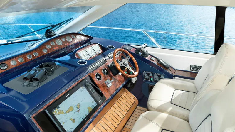 1691 Yacht Photos Pics Luxurious 2000 Princess V65 yacht cockpit with navigation equipment and leather seating.