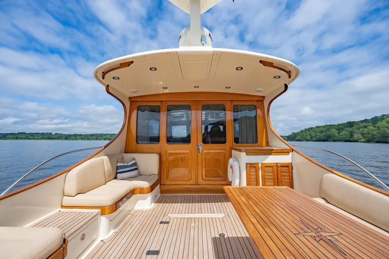 Dreadnought Yacht Photos Pics Luxurious 2007 Vicem 65 yacht deck with elegant wood finish and comfortable seating.