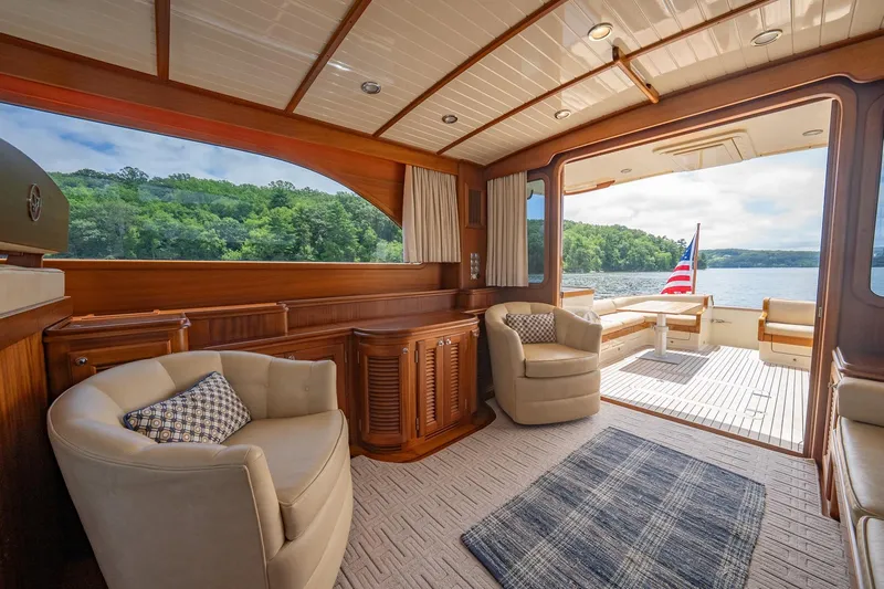 Dreadnought Yacht Photos Pics Luxurious 2007 Vicem 65 yacht interior with elegant seating and scenic lake view.