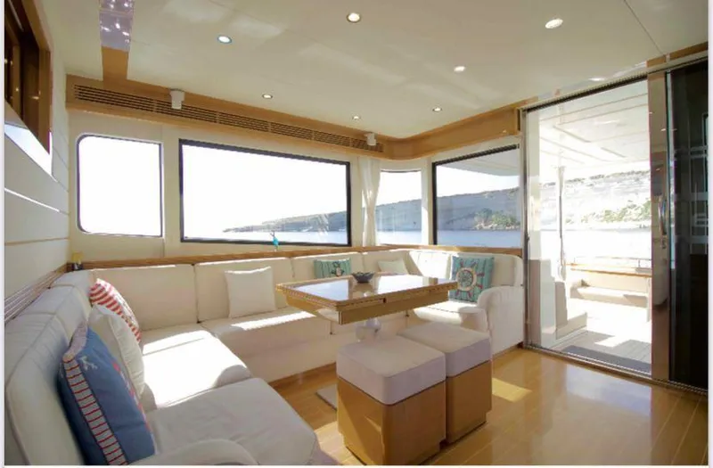  Yacht Photos Pics Luxurious interior of 2013 Apreamare Maestro 65 yacht with elegant seating and large windows.